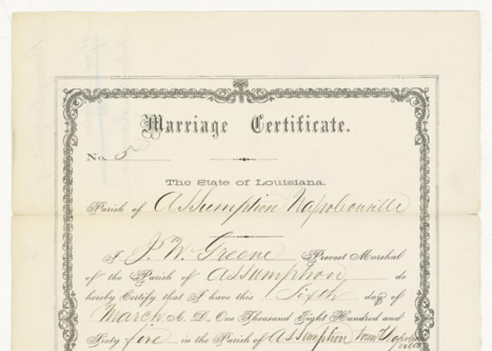 Cream document with black type and handwritten text and signatures.