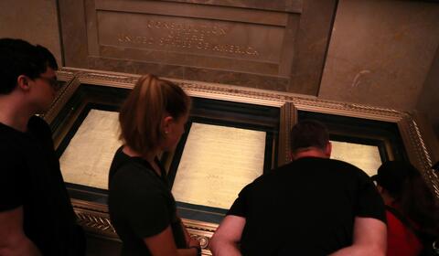 people looking at exhibit