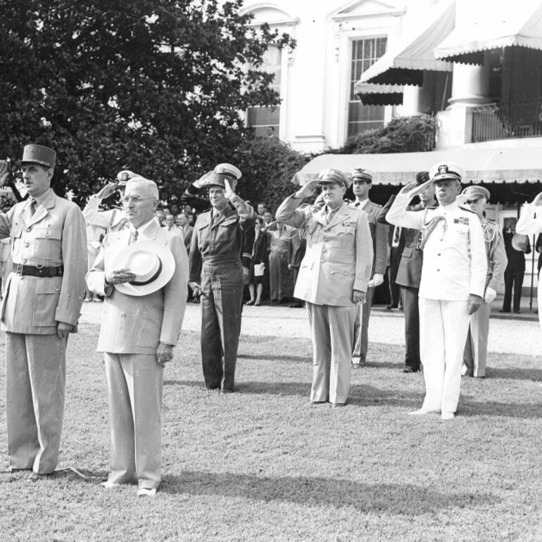 Black and white photograph of military men standing at attention.