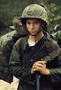 Young Marine waits on the beach during the Marine landing