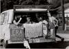 Black and White photo women in car with signs