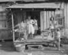 Miners' wives and children on front porch.