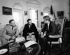 Black and white photograph of three men in the oval office