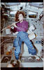 Mission Specialist Ellen Ochoa playing a flute