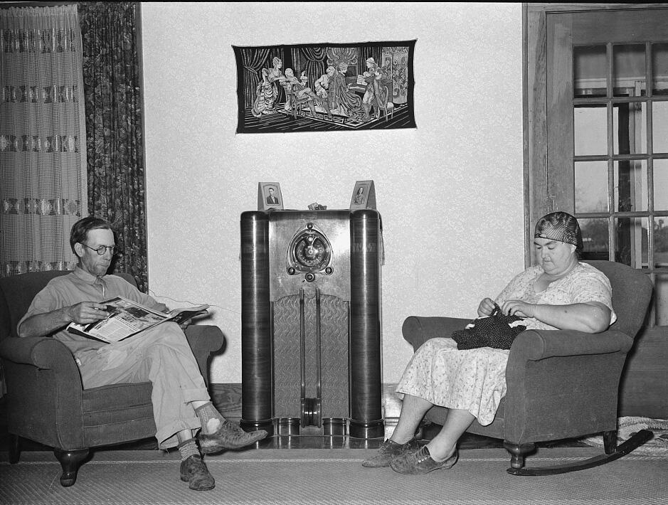 Man and woman sitting in their living room.