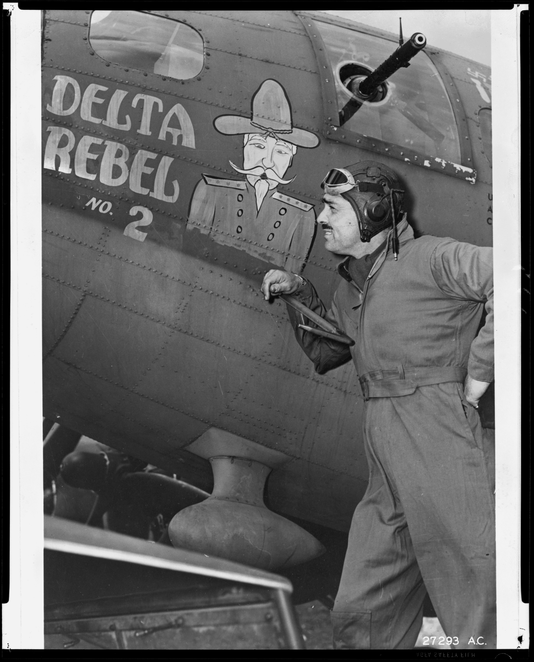 Clark Gable with the Delta Rebel No. 2, a B-17 Flying Fortress heavy bomber. Gable flew on Delta Rebel No. 2 for a combat mission while filming the documentary Combat America.