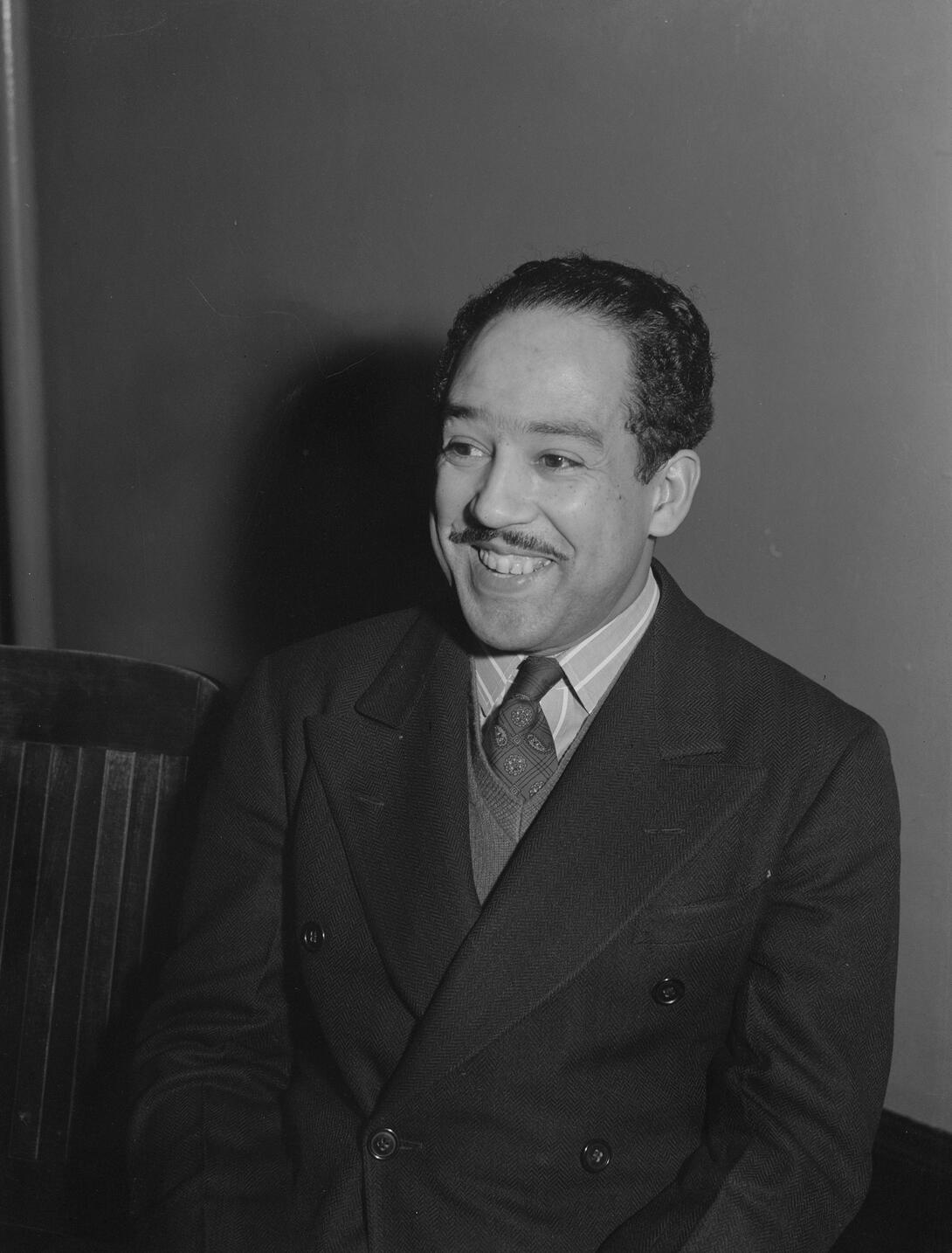 Black and white photograph of smiling man