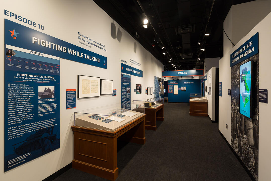 Color photograph of exhibit gallery with exhibit cases and text labels